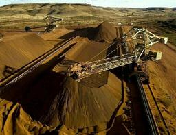 Iron ore dips on increased supply; dollar strength caps gains