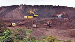 Iron ore slides on weak China data, lower steel prices